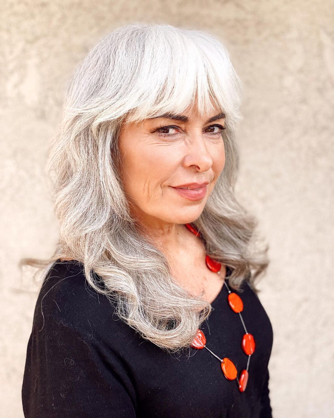 Over 50 Long Thick Salt-and-Pepper Shag with Bangs