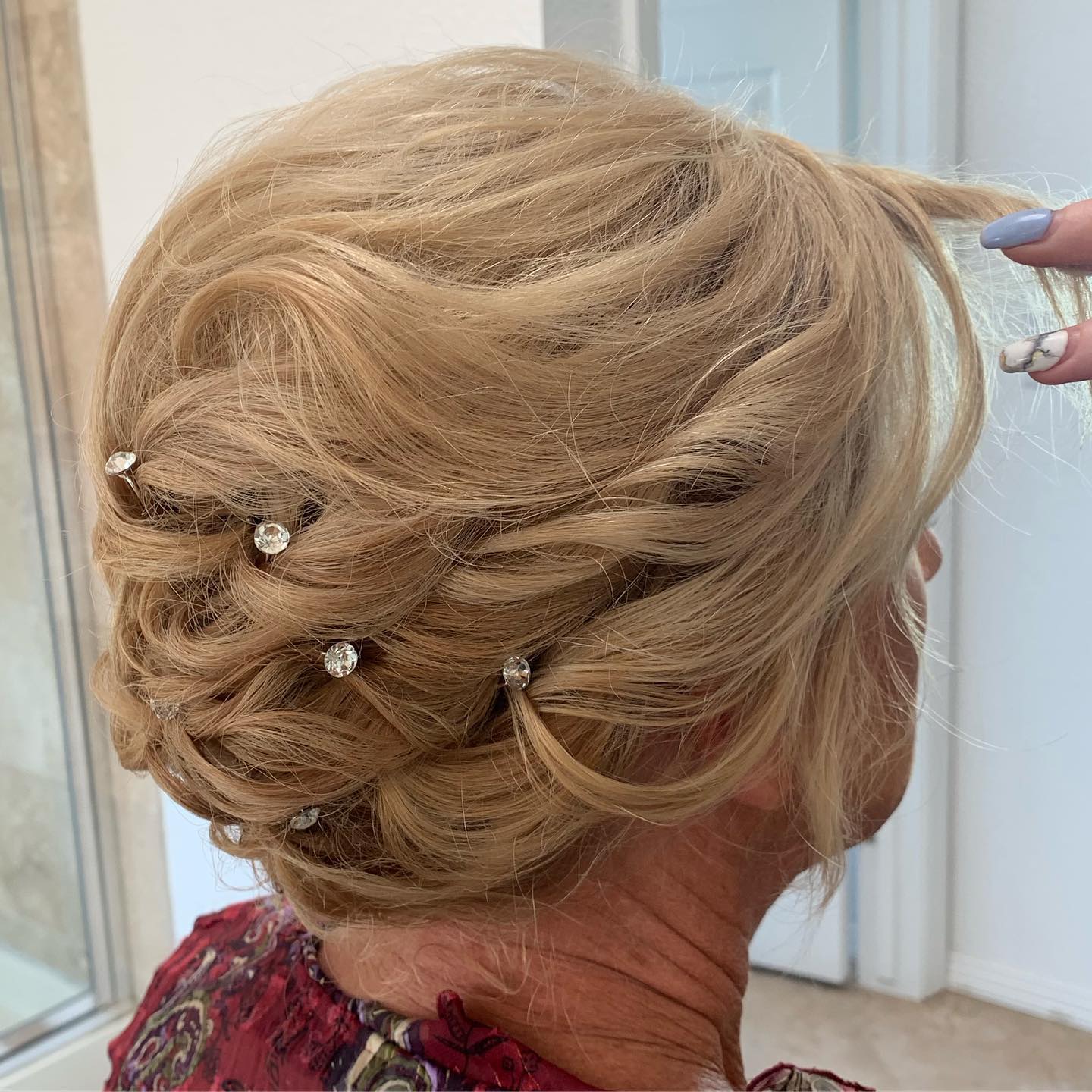 Airy Mother-of-the-Bride Updo with Rhinestones